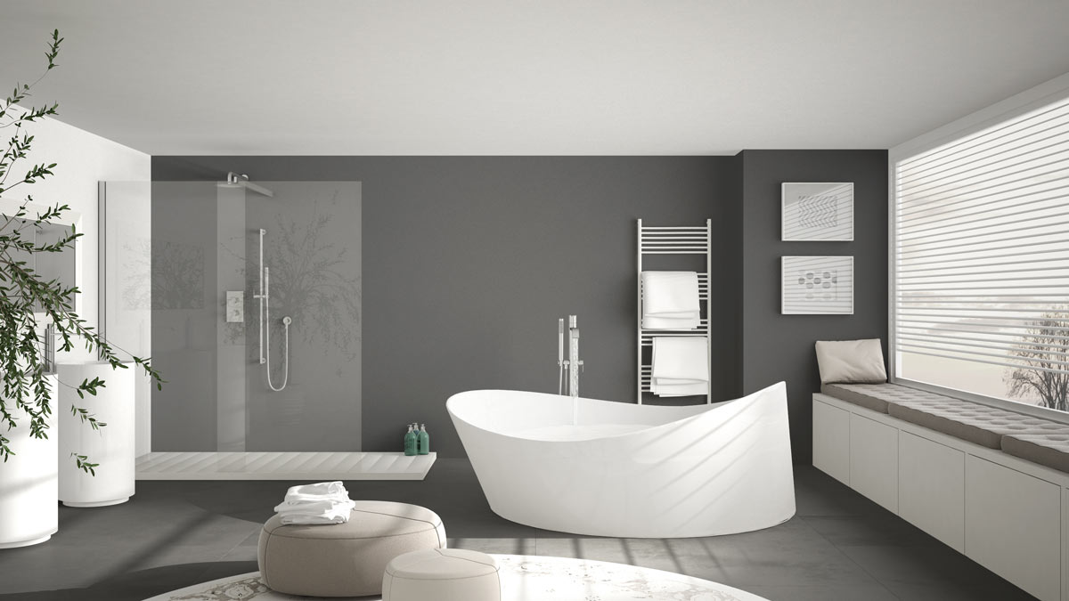 Bagno moderno grigio con vasca design bianca.
