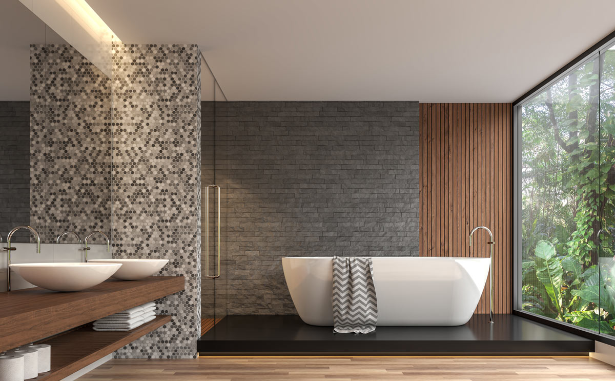 Un bagno moderno con diverse tonalità di grigi.