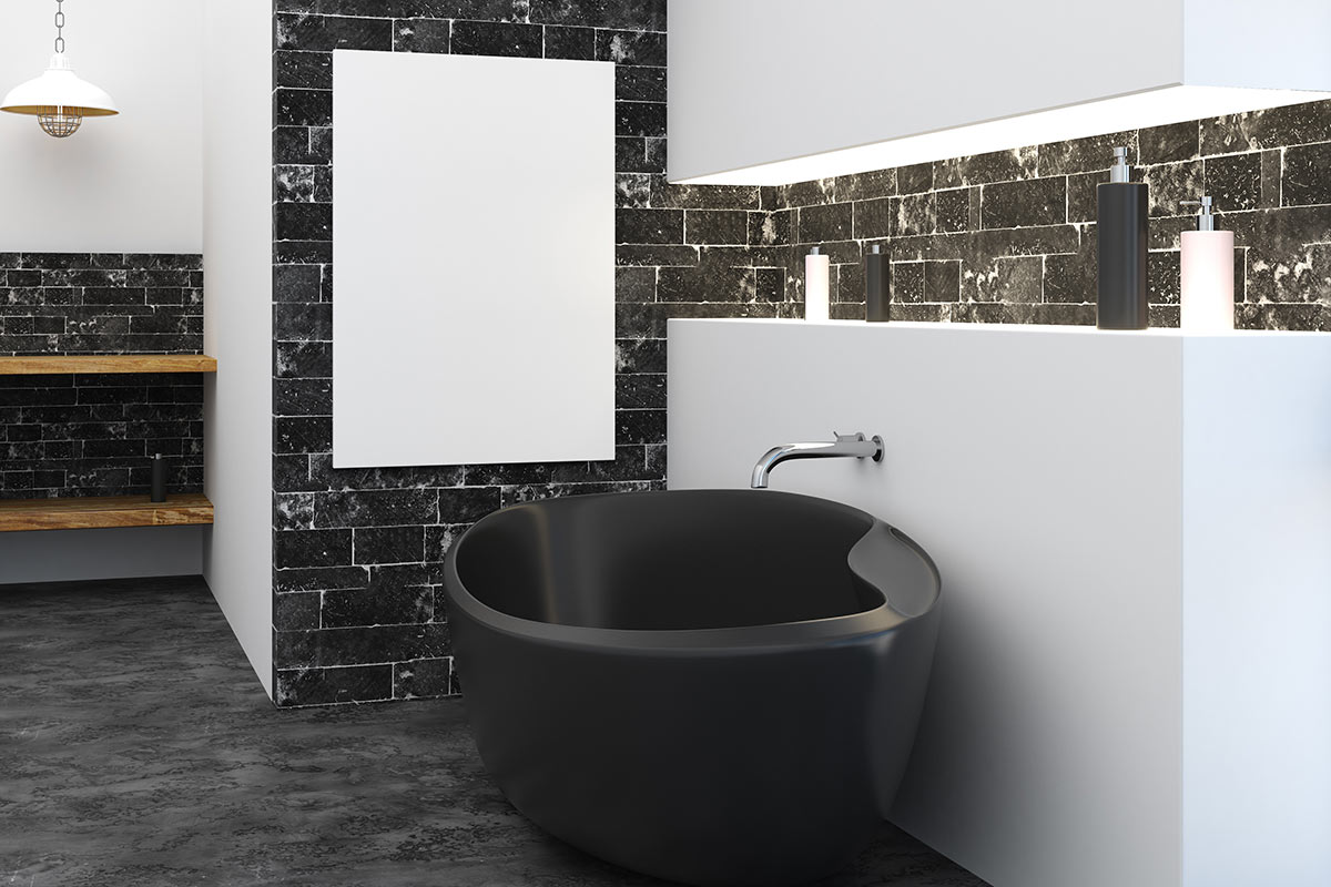 bagno con rivestimento formato da mattoncini di pietra nero e bianco