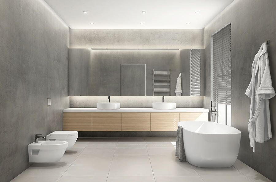 Sanitari sospesi bianchi in un bagno dal design moderno gris chiaro con mobile in legno.
