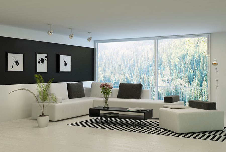 Salotto arredato in stile minimal bianco e nero.