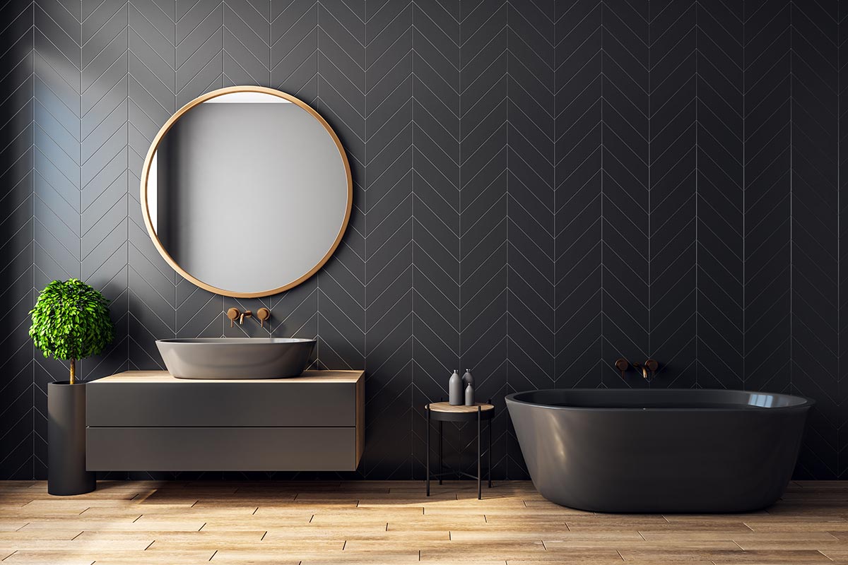 Rivestimento bagno moderno nero con motivi geometrici.